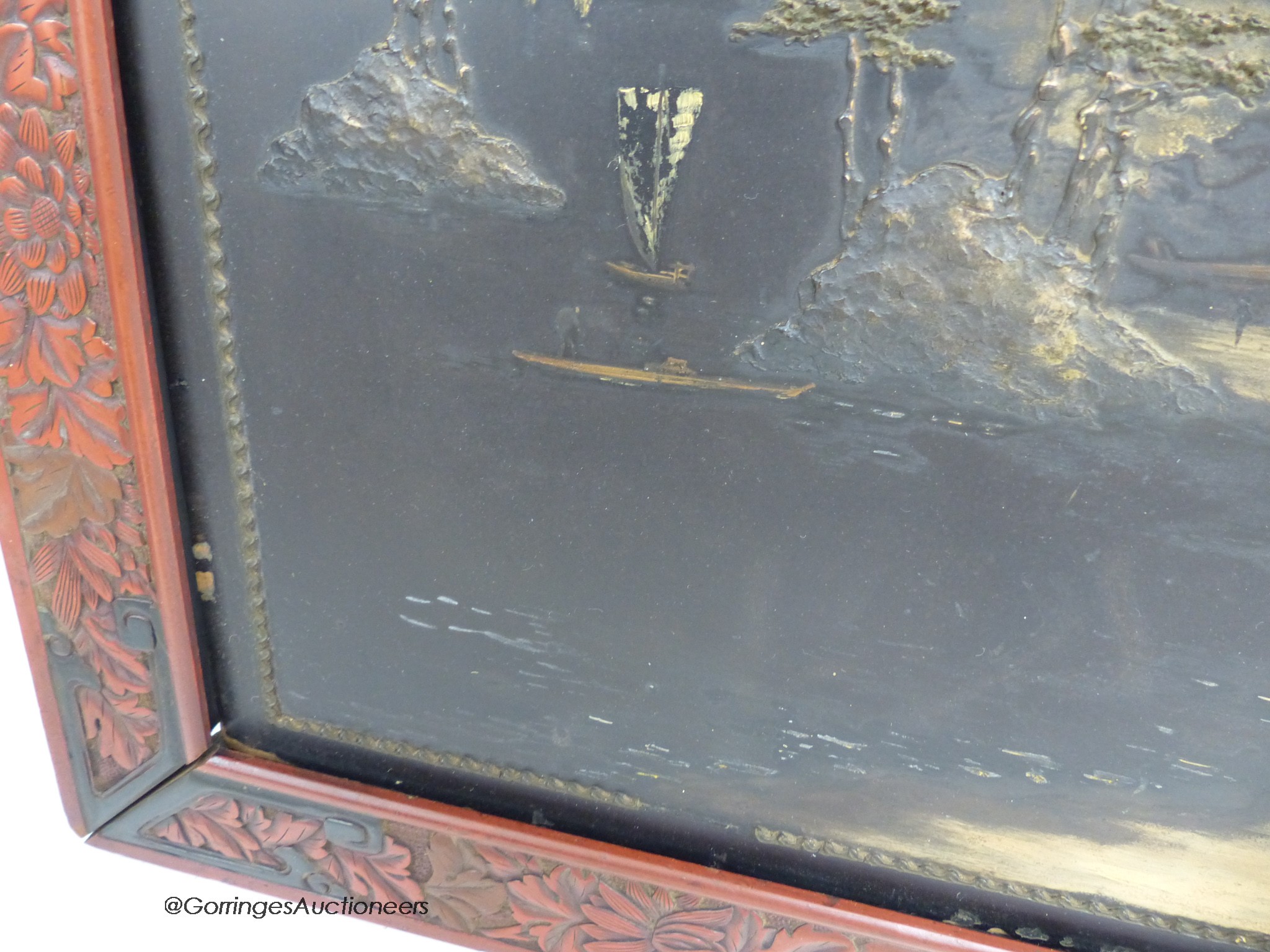 A Japanese lacquer landscape panel, in red lacquered frame, 59 x 59cm